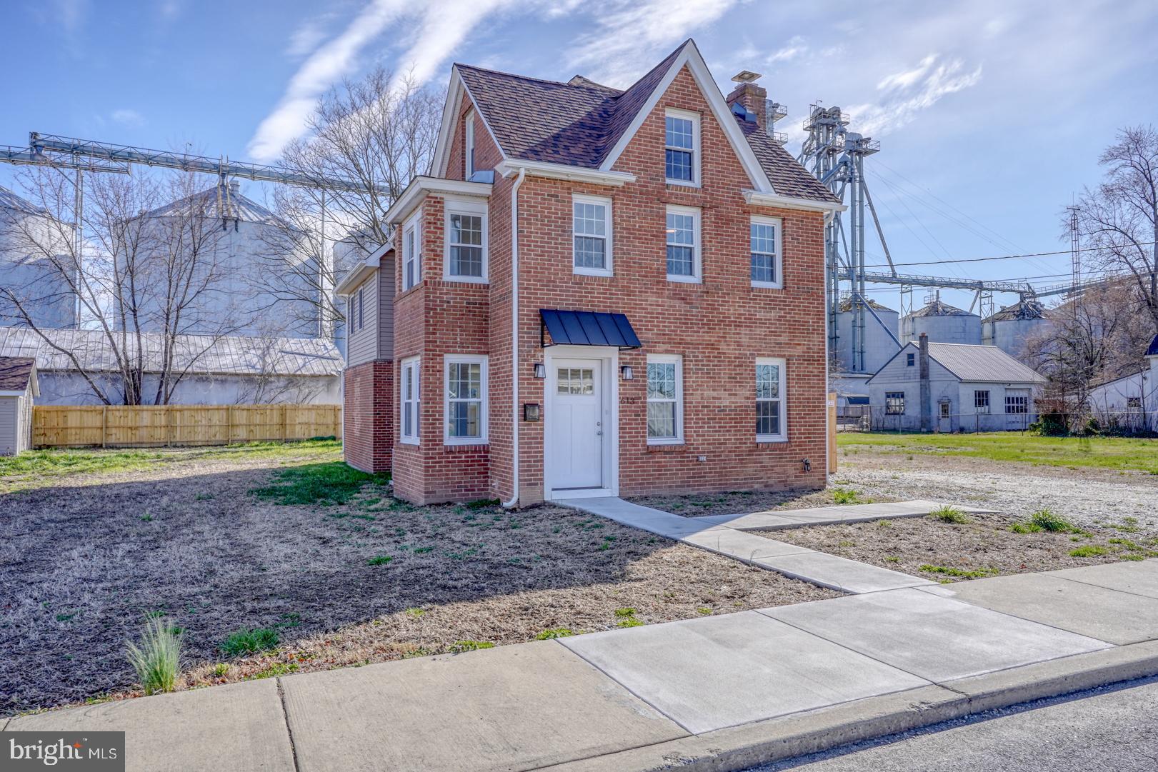 613 Taylor Street Townsend, DE 19734 - Photo 2 of 36 a front view of a house with a yard