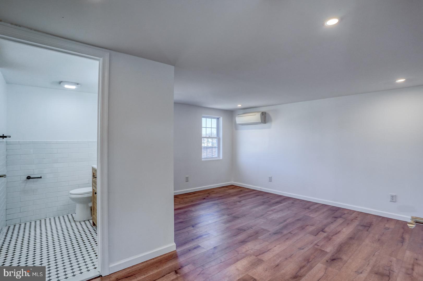 613 Taylor Street Townsend, DE 19734 - Photo 21 of 36 a view of a room with wooden floor and toilet