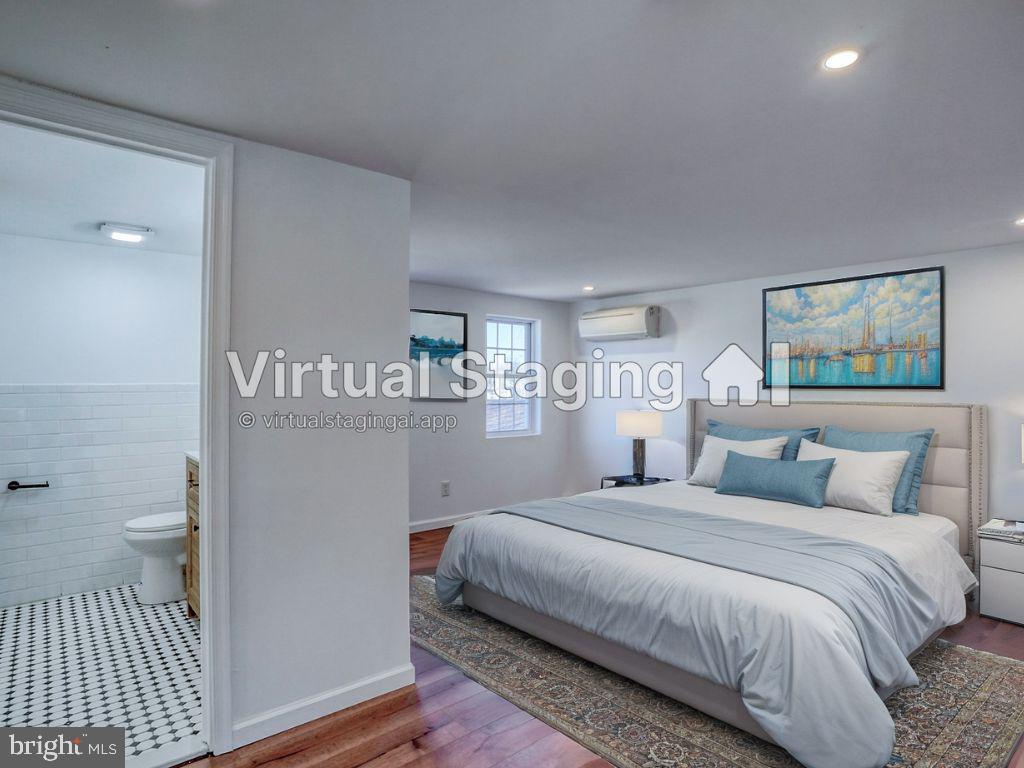 613 Taylor Street Townsend, DE 19734 - Photo 22 of 36 a bedroom with a bed and a table