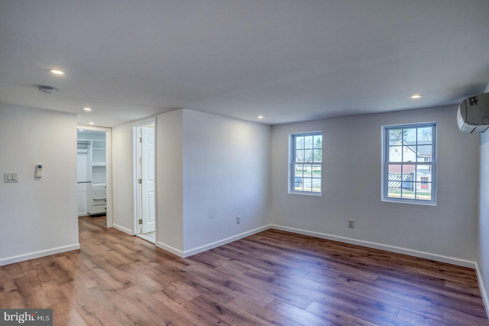 613 Taylor Street Townsend, DE 19734 - Photo 23 of 36 a view of an empty room with wooden floor and a window