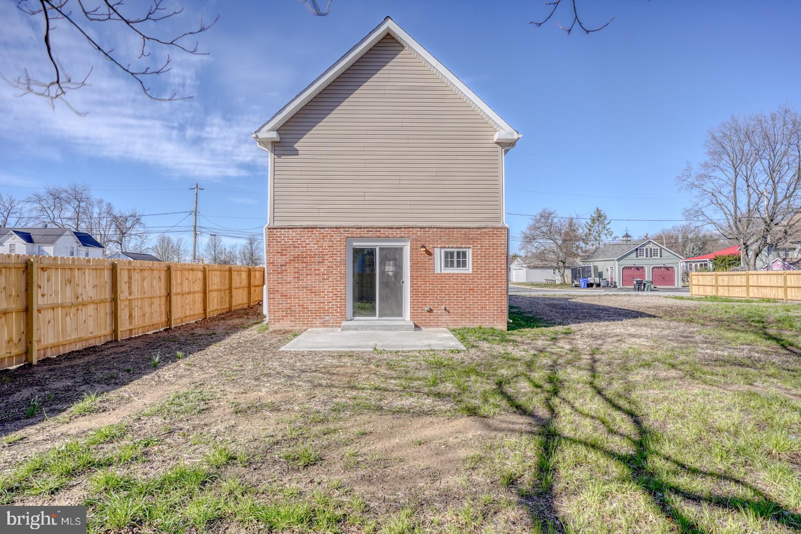 613 Taylor Street Townsend, DE 19734 - Photo 6 of 36 a front view of a house with a yard