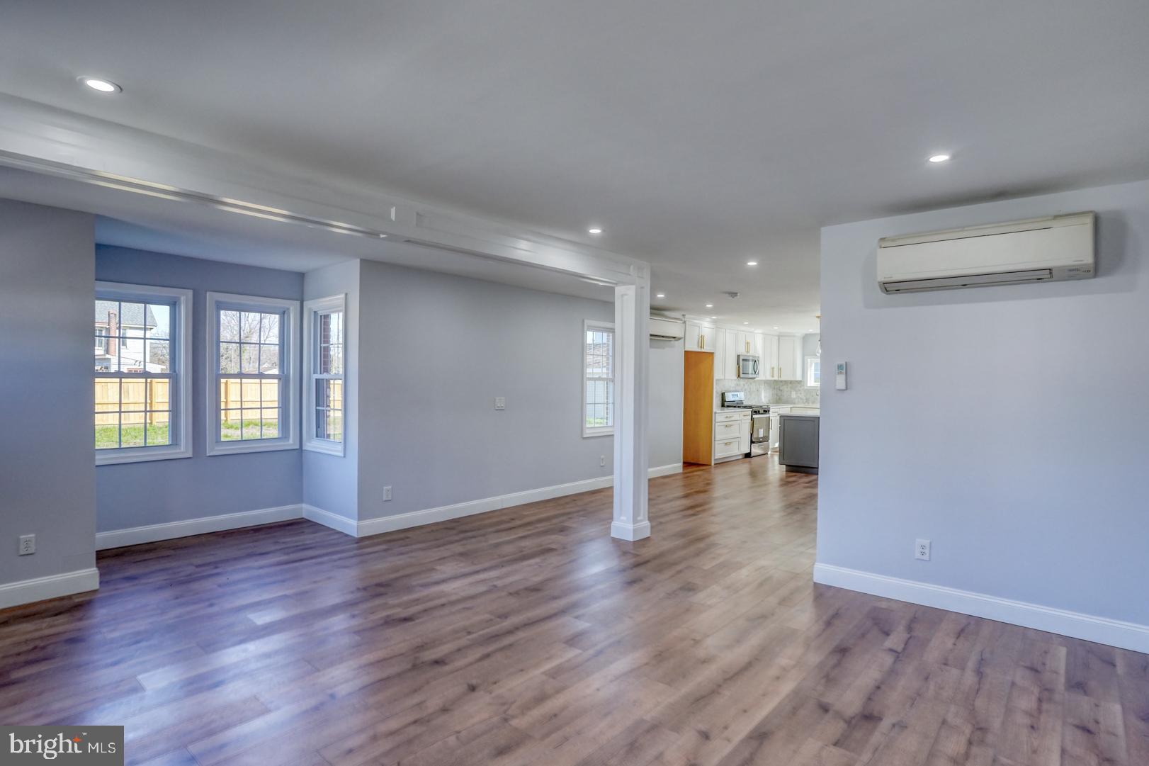 613 Taylor Street Townsend, DE 19734 - Photo 9 of 36 a view of an empty room with wooden floor and a window