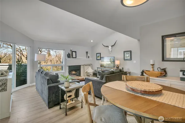 a kitchen with granite countertop stainless steel appliances a sink stove top oven and cabinets