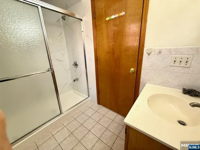 a bathroom with a tub and shower