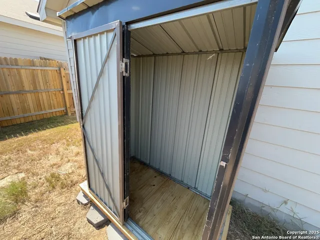 a view of a brick house with a large window