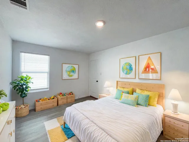 a bedroom with a bed and a couch