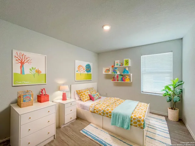a bedroom with a bed and a bookshelf