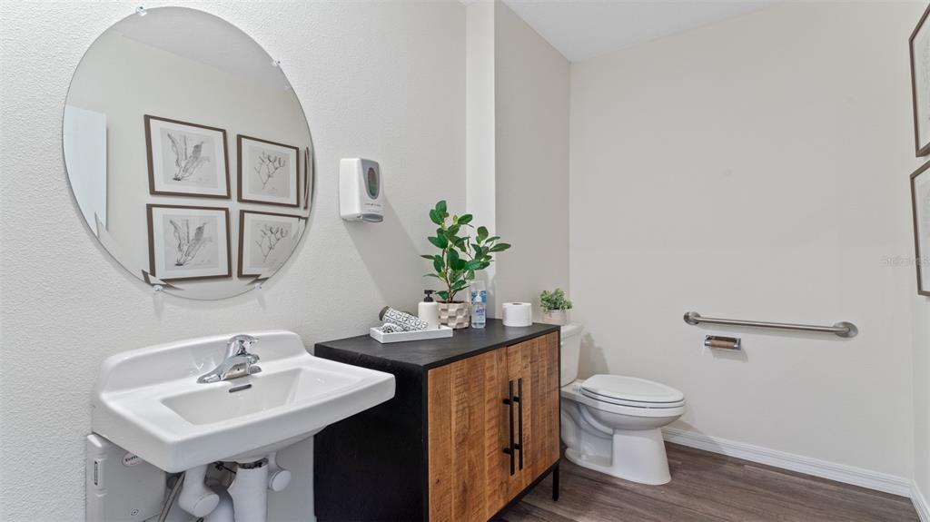 5221 Masser Road St. Cloud, FL 34772 - Photo 28 of 39 a bathroom with a toilet sink and mirror