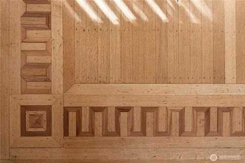 a view of a door with wooden floor