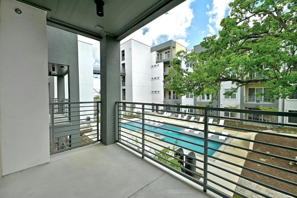 a view of a balcony with chairs