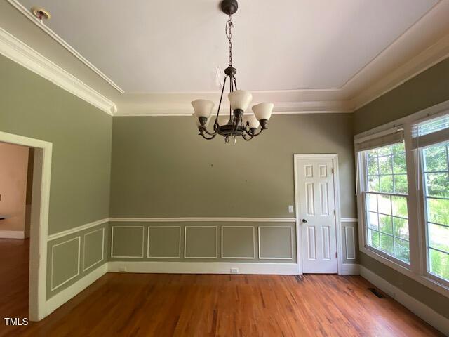 10912 Cahill Road Raleigh, NC 27614 - Photo 18 of 61 a view of empty room with wooden floor and fan
