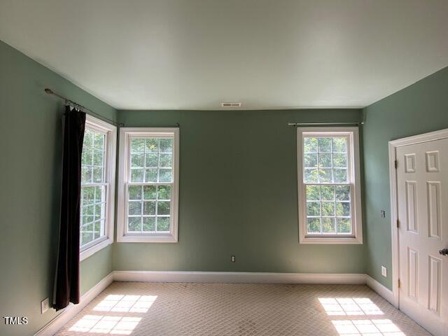 10912 Cahill Road Raleigh, NC 27614 - Photo 23 of 61 a view of an empty room with a window