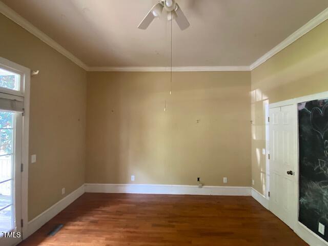 10912 Cahill Road Raleigh, NC 27614 - Photo 3 of 61 a view of an empty room with wooden floor and a window