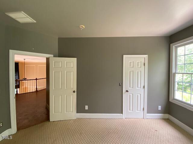 10912 Cahill Road Raleigh, NC 27614 - Photo 42 of 61 an empty room with windows