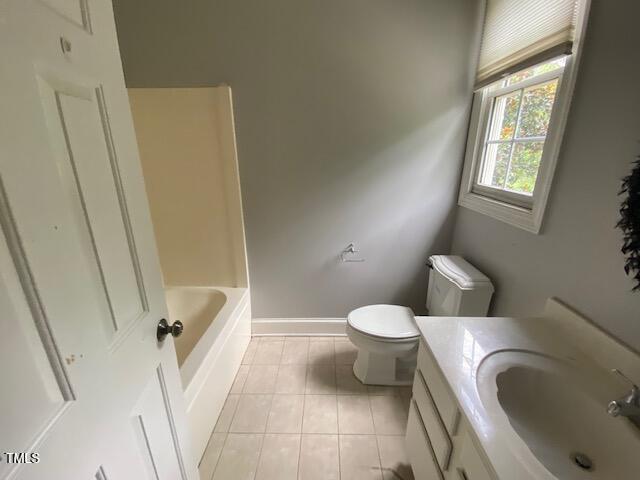 10912 Cahill Road Raleigh, NC 27614 - Photo 46 of 61 a white toilet sitting next to a bathroom sink and a tub