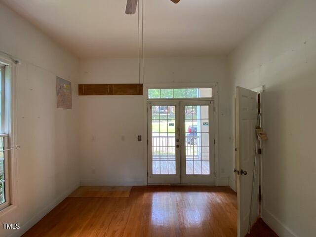 10912 Cahill Road Raleigh, NC 27614 - Photo 8 of 61 a view of empty room with wooden floor and fan