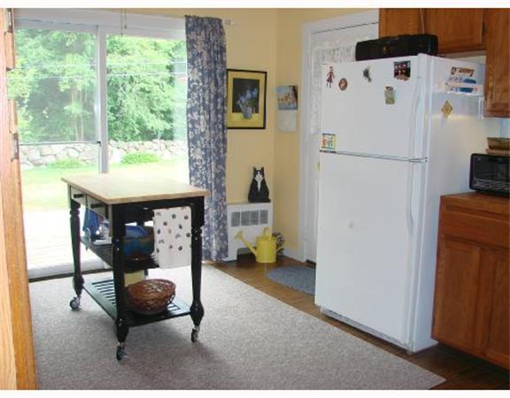 982 Crandall Road Tiverton, RI 02878 - Photo 4 of 10 a hallway that has a couch and a refrigerator