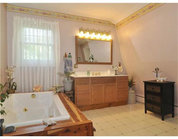 982 Crandall Road Tiverton, RI 02878 - Photo 8 of 10 a bathroom with a tub sink and mirror