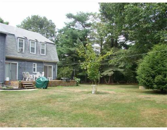 982 Crandall Road Tiverton, RI 02878 - Photo 10 of 10 a front view of a house with a yard