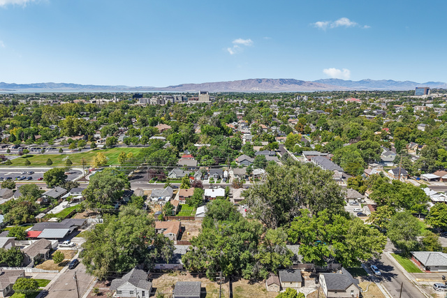 768 300 North Provo, UT 84606 - Photo 12 of 51 Aerial perspective of the surrounding residential area featuring established green spaces and distant mountain ranges