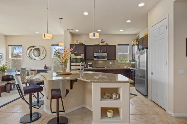 a kitchen with a table and chairs in it