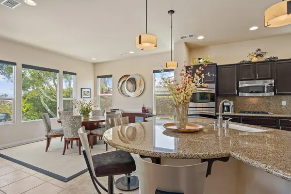 a dining room with furniture window and wooden floor