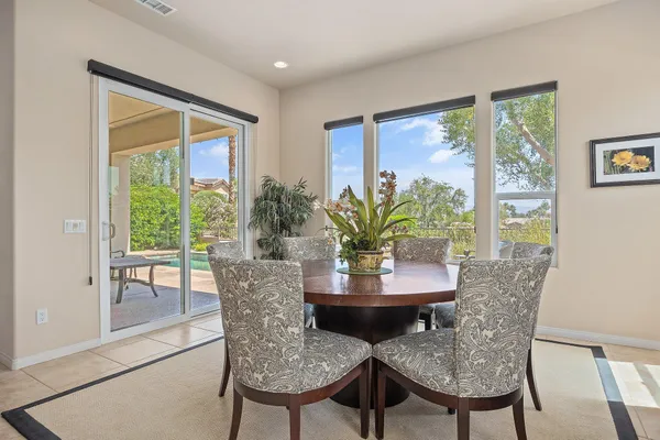 a view of a dining room with furniture window and outside view