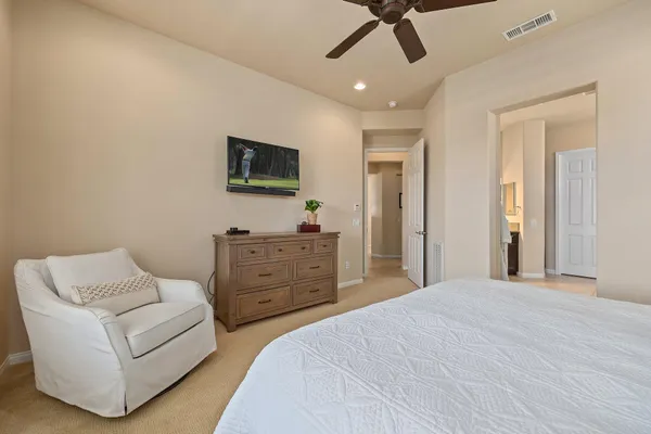 a bathroom with a granite countertop sink a large mirror and a shower