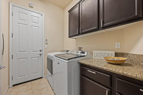 a living room with patio furniture and a yard