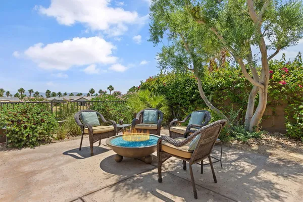 a dining room with furniture and a garden