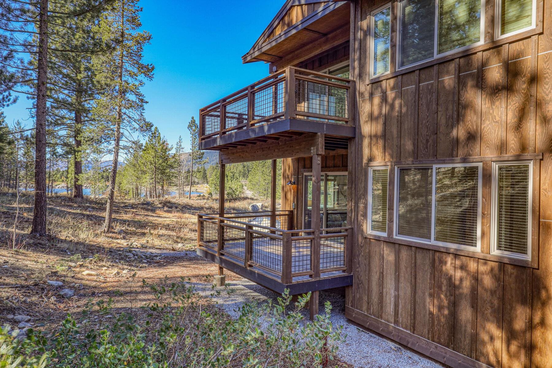 11643 McClintock Loop, Unit 3 Truckee, CA 96161 - Photo 13 of 21 a view of a wooden house with a wooden fence