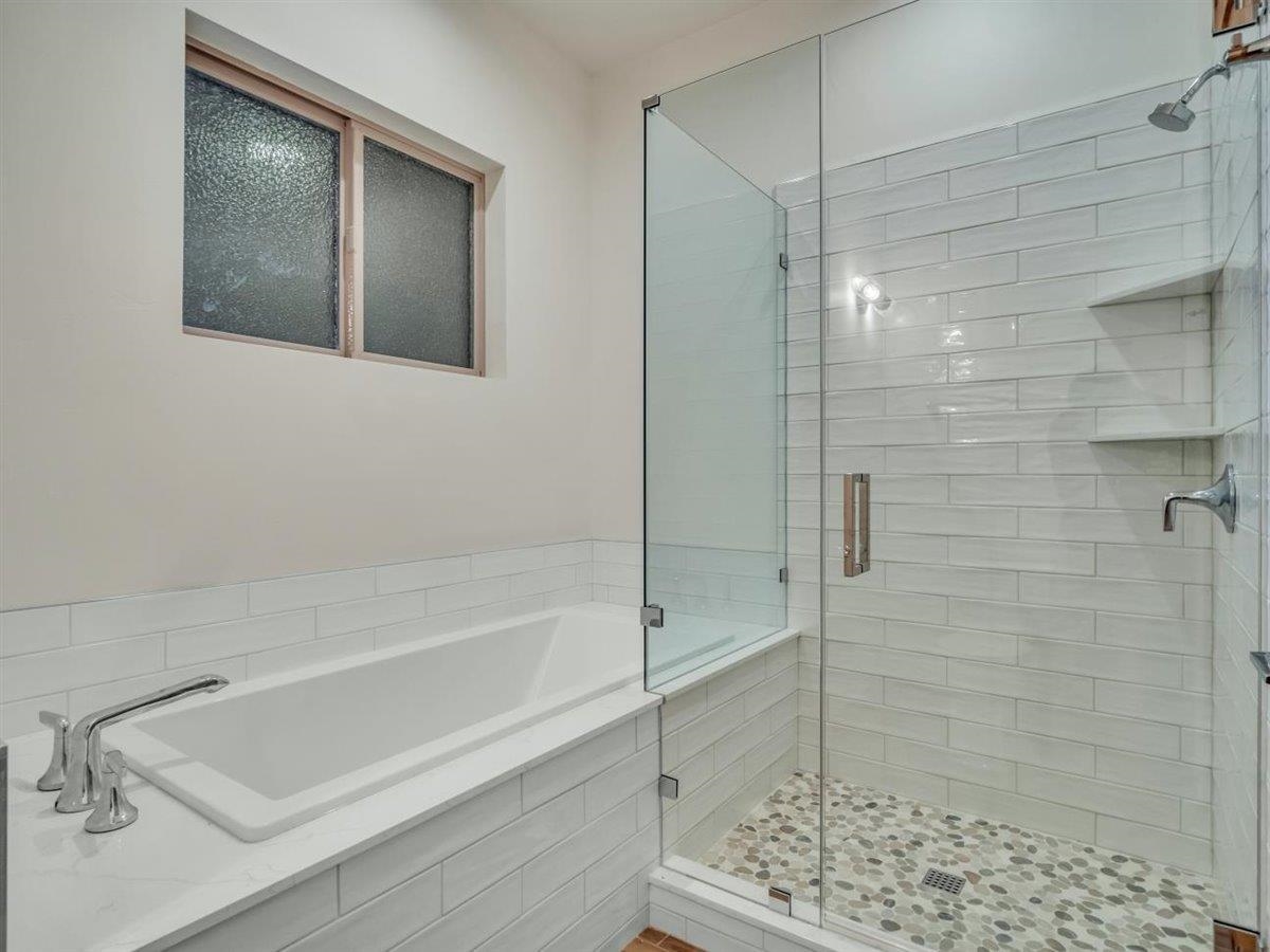 11643 McClintock Loop, Unit 3 Truckee, CA 96161 - Photo 6 of 21 a bathroom with a bathtub and a shower