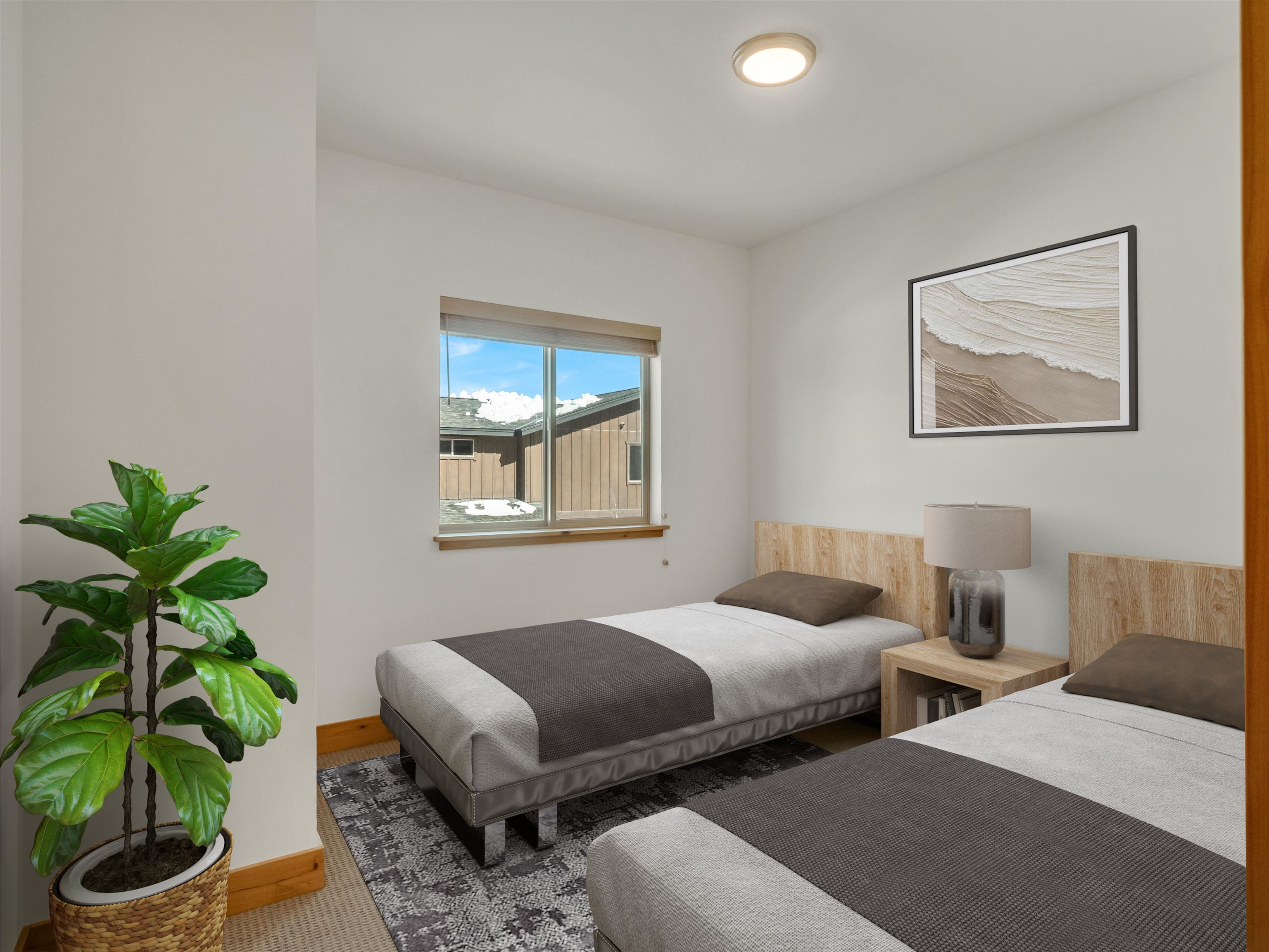 11643 McClintock Loop, Unit 3 Truckee, CA 96161 - Photo 10 of 21 a bedroom with two beds and a potted plant
