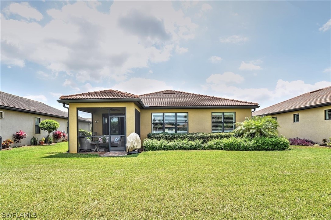 10928 Dennington Road Fort Myers, FL 33913 - Photo 25 of 35 a front view of house with yard and green space