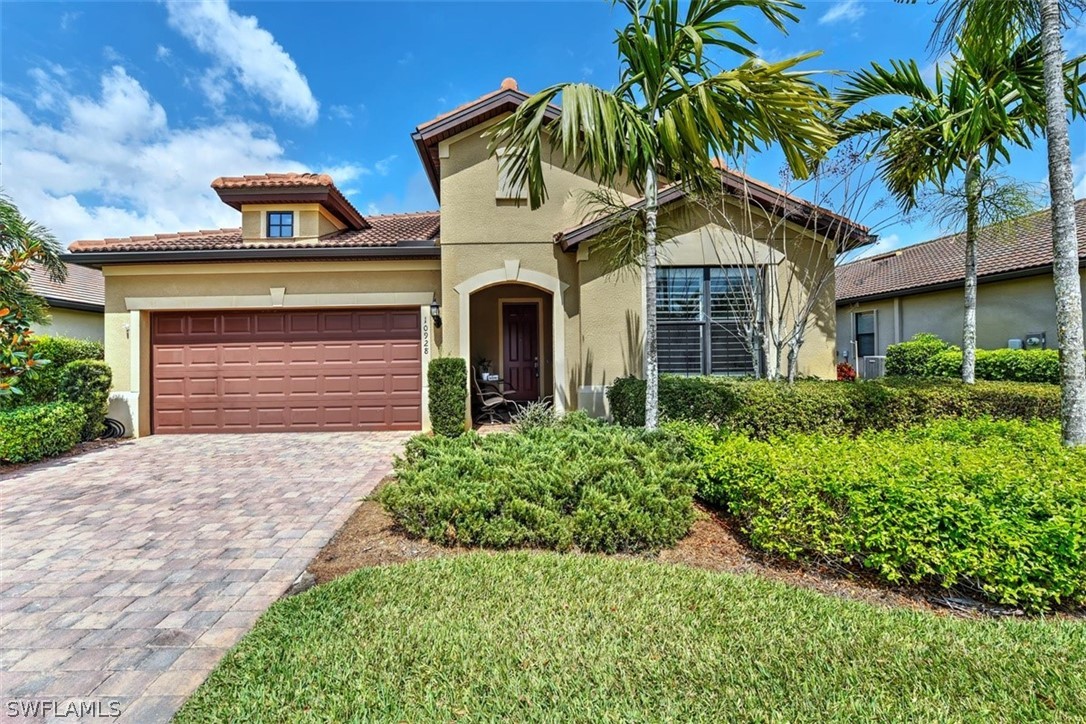 10928 Dennington Road Fort Myers, FL 33913 - Photo 5 of 35 a front view of a house with a yard