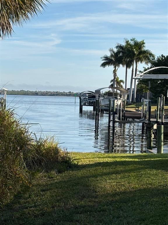 3098 Holcomb Road Port Charlotte, FL 33981 - Photo 4 of 5 a view of a lake with a big yard