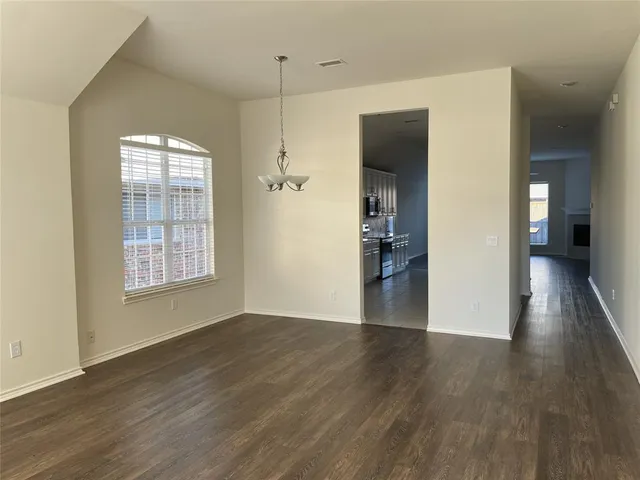 a view of livingroom with hardwood floor and a window