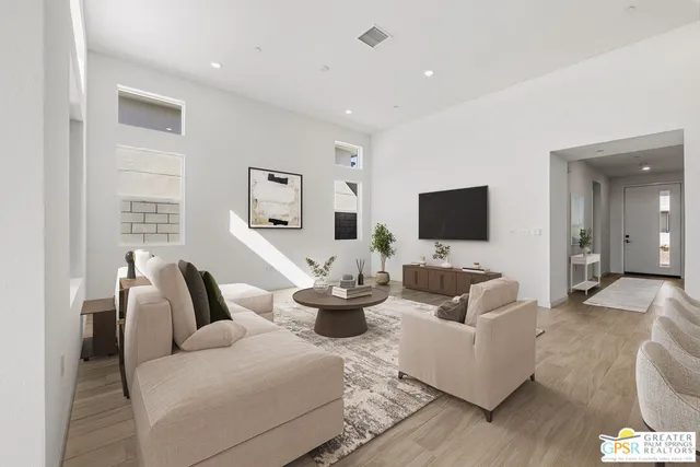 a kitchen with white cabinets and appliances