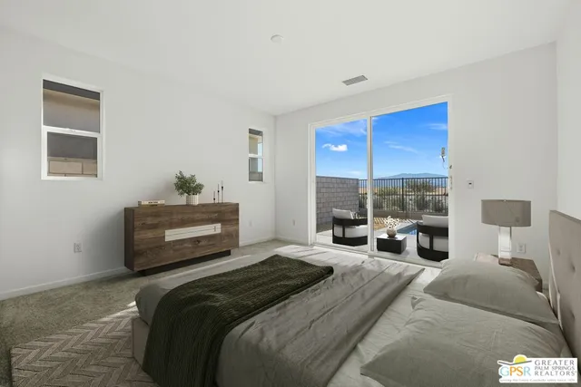 a spacious bedroom with a bed and a couch