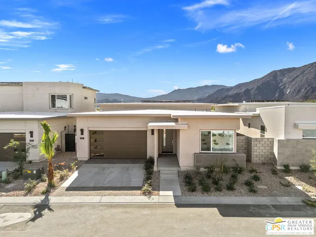a view of a terrace with lawn chairs