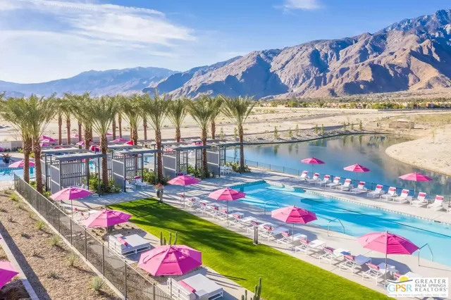 a view of swimming pool with an outdoor seating