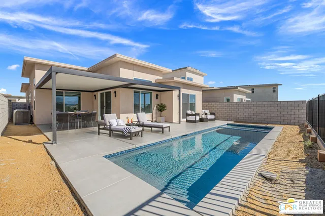a view of a dinning table and chairs in patio