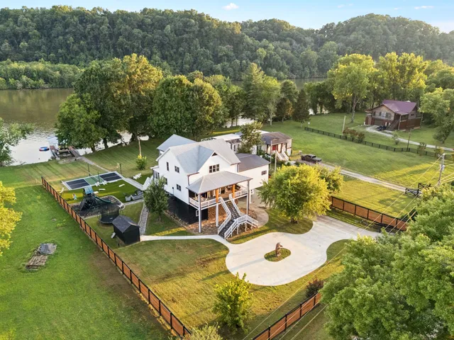 an aerial view of a house with outdoor space