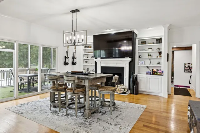 a kitchen with stainless steel appliances granite countertop a stove a sink and white cabinets