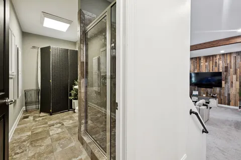 a bathroom with a toilet a sink and a mirror