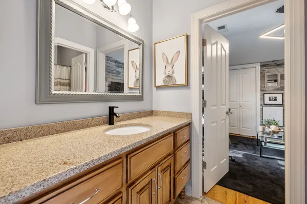a bed room with a bed and a large window