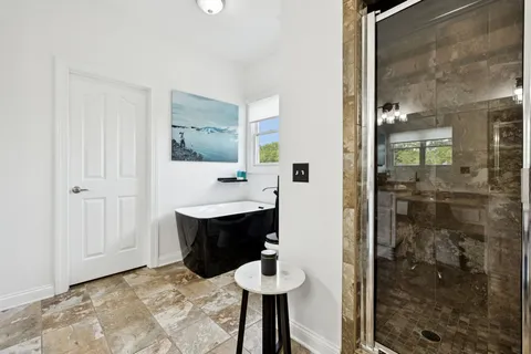 a kitchen with a sink appliances and cabinets