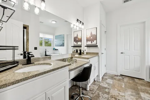 a bedroom with bed and a window