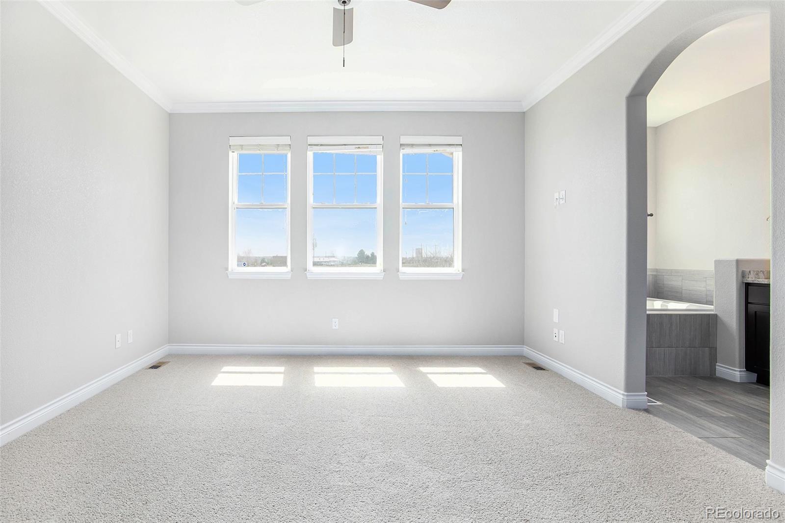 3751 West 136th Avenue, Unit C3 Broomfield, CO 80023 - Photo 13 of 20 an empty room with windows
