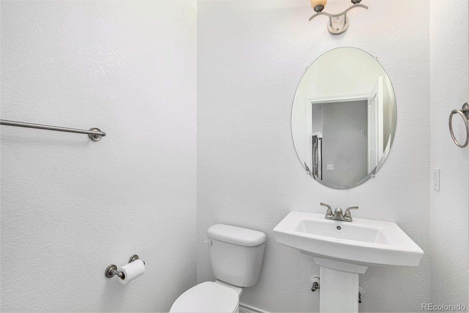 3751 West 136th Avenue, Unit C3 Broomfield, CO 80023 - Photo 16 of 20 a bathroom with a sink mirror and toilet